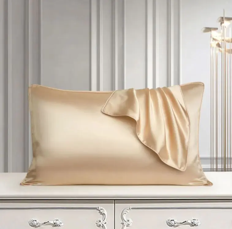 Champagne mulberry silk pillowcase on dresser, elegant bedroom setting
